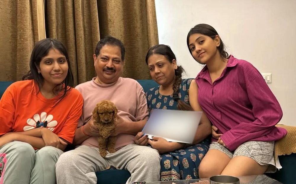 Family at home with their new Poodle puppy in Delhi NCR